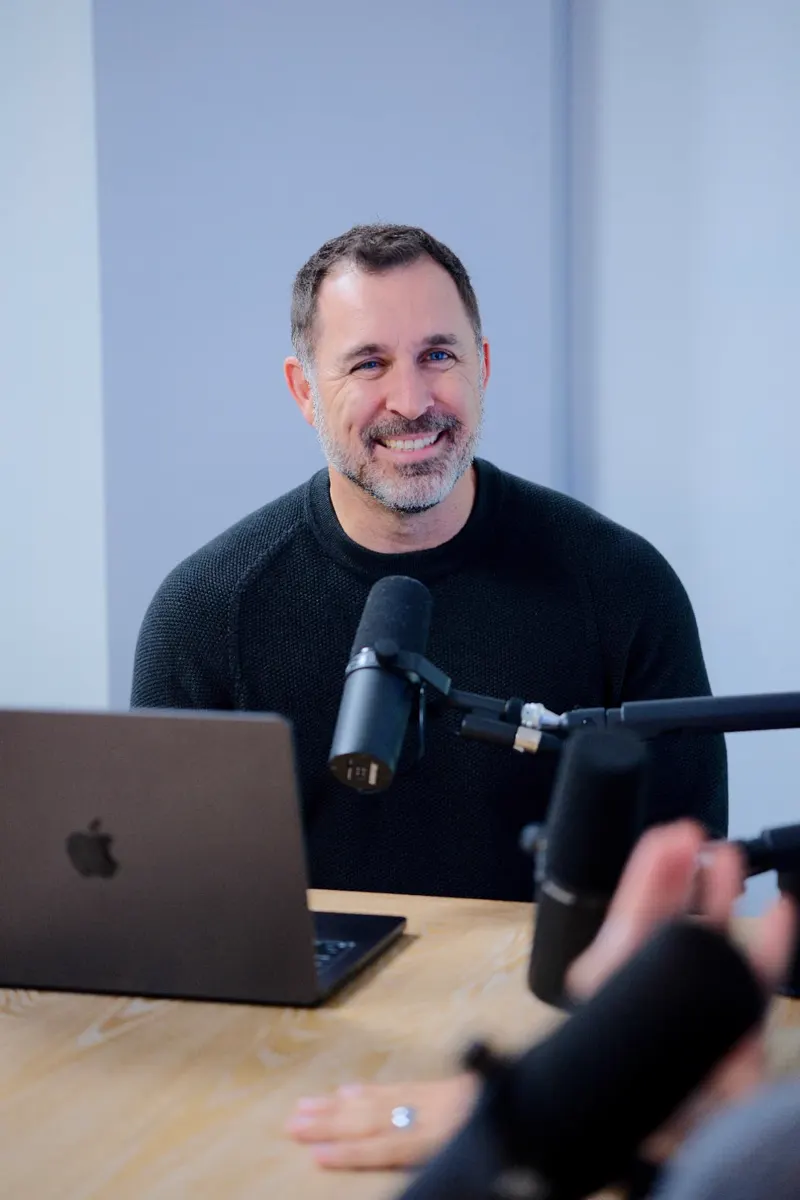 Josh Foliart recording an episode at his podcast desk